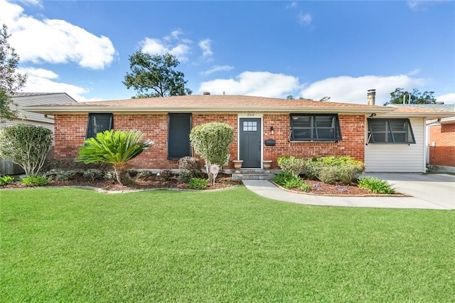 ranch-style house with brick siding and a front lawn