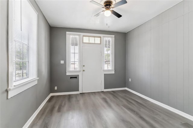 entrance foyer featuring hardwood / wood-style floors, ceiling fan, and a healthy amount of sunlight