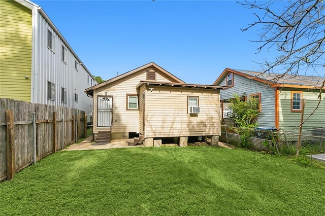 back of property with a yard and cooling unit