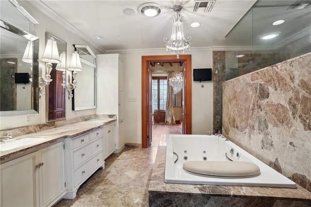 bathroom with vanity, tiled bath, an inviting chandelier, and ornamental molding