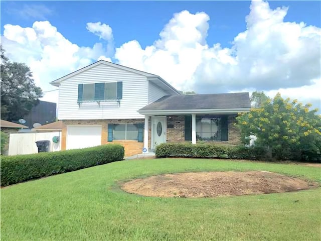 split level home with a garage and a front lawn