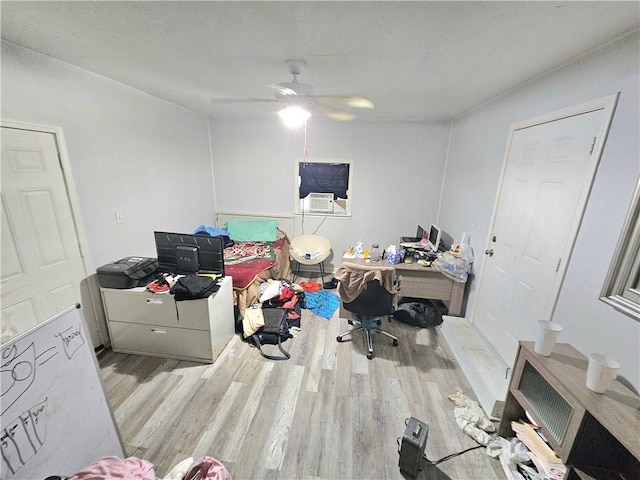 home office with ceiling fan and light wood-type flooring