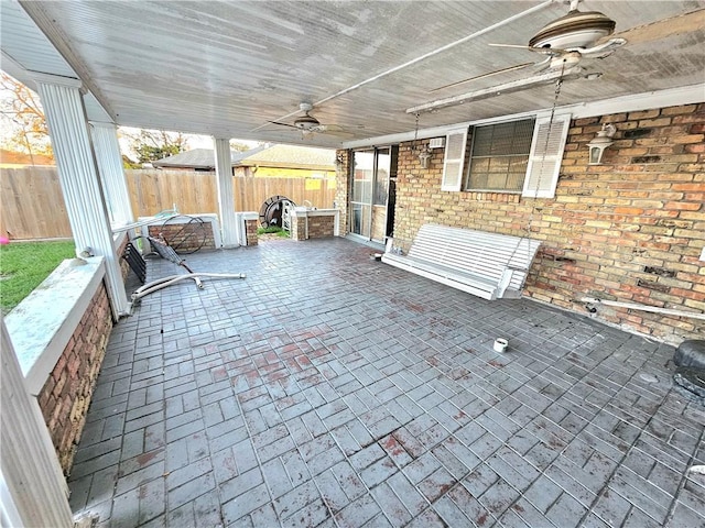 view of patio featuring ceiling fan