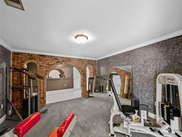 exercise room featuring carpet flooring and crown molding