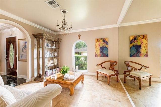 sitting room with ornamental molding, light tile patterned floors, and a notable chandelier