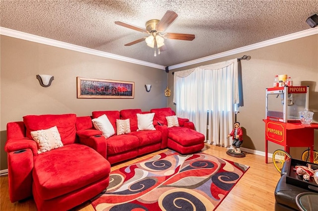 living room with ornamental molding, wood-type flooring, a textured ceiling, and ceiling fan