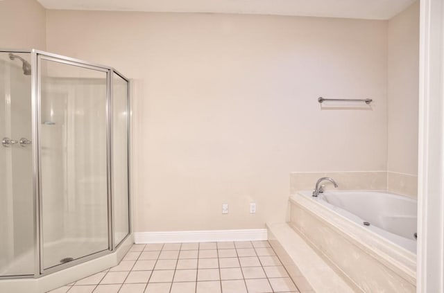 bathroom featuring tile patterned floors and separate shower and tub