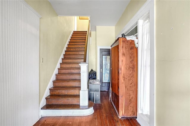 stairs featuring hardwood / wood-style flooring