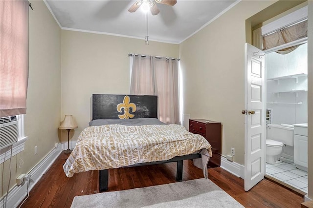 bedroom with ceiling fan, hardwood / wood-style floors, ensuite bathroom, and crown molding