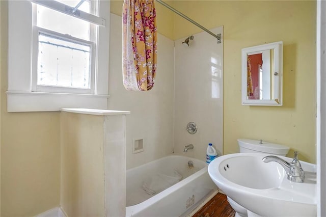 bathroom featuring  shower combination and sink