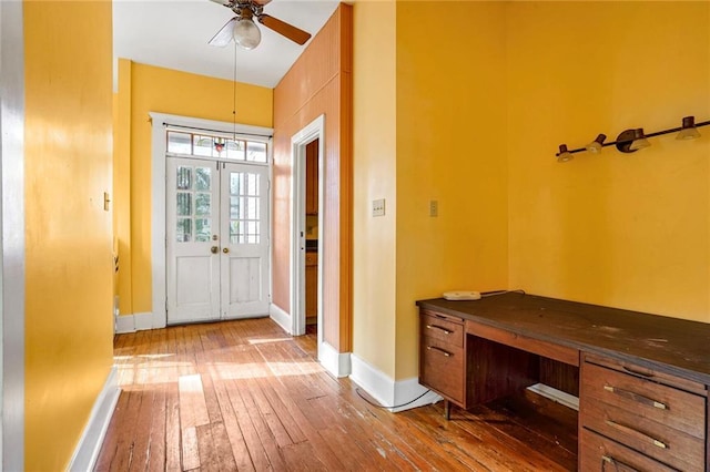 entryway featuring french doors, hardwood / wood-style flooring, and ceiling fan