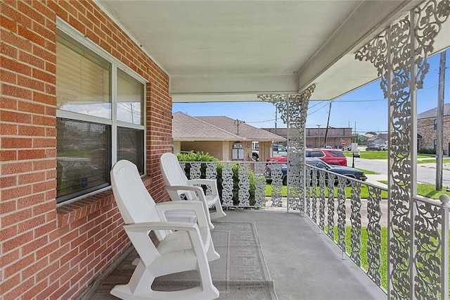 view of patio / terrace featuring a porch and a residential view