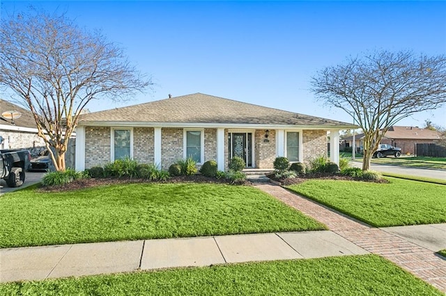 ranch-style house with a front yard