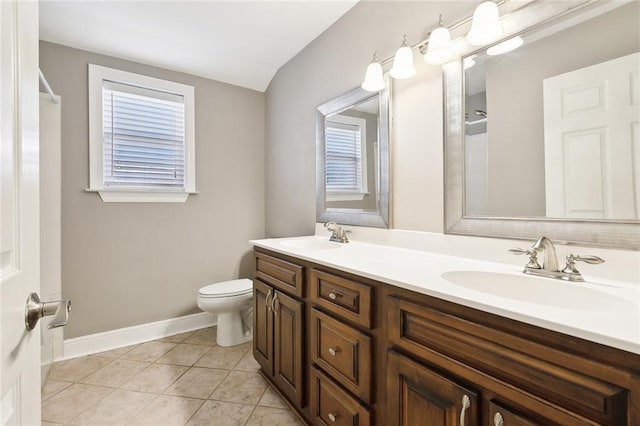 bathroom featuring toilet, vanity, and tile patterned floors