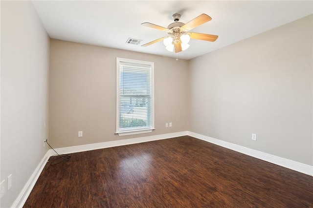 empty room featuring ceiling fan and hardwood / wood-style flooring