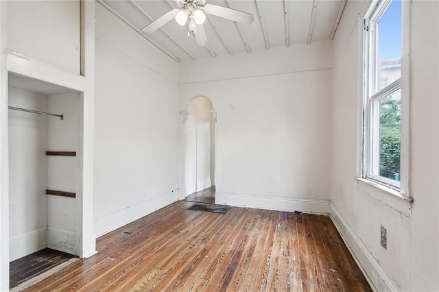 empty room with hardwood / wood-style flooring and ceiling fan