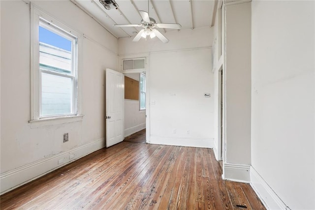 unfurnished room featuring ceiling fan and hardwood / wood-style flooring