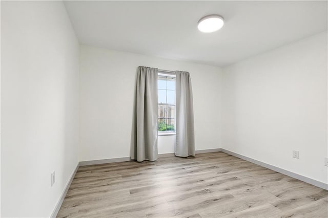 unfurnished room featuring light hardwood / wood-style flooring