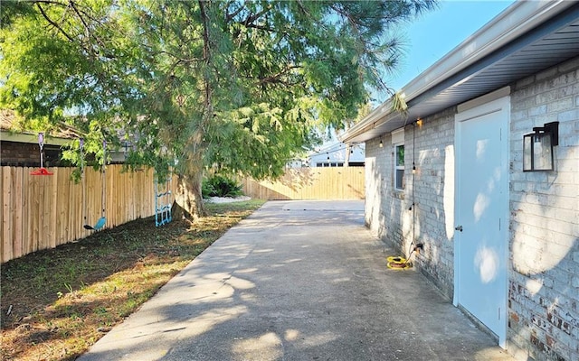 view of property exterior with a patio