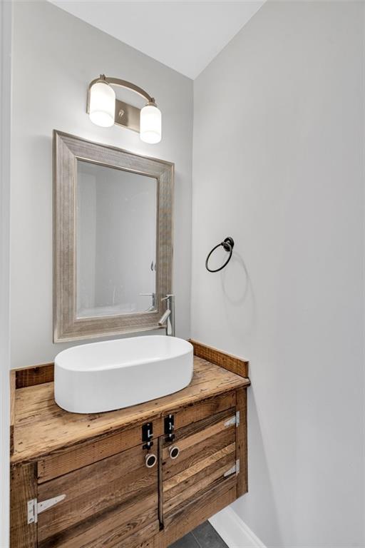 bathroom featuring tile patterned flooring and vanity