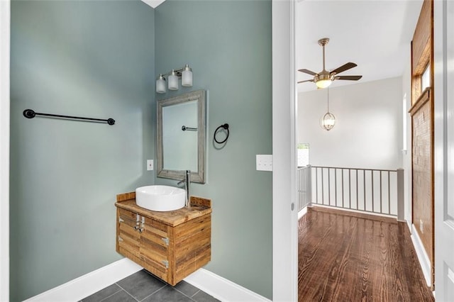 bathroom featuring ceiling fan and vanity