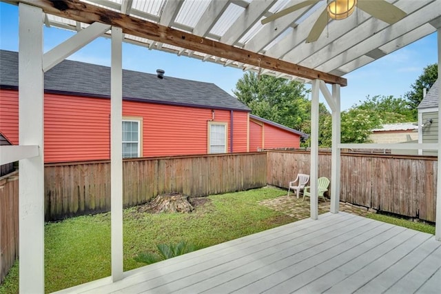 deck featuring a lawn and ceiling fan