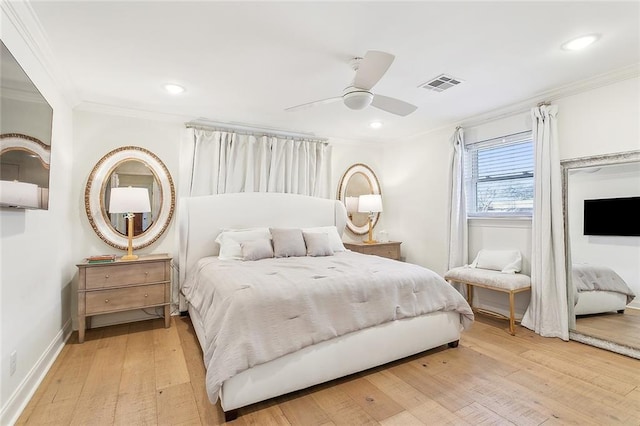 bedroom with ceiling fan, ornamental molding, and light hardwood / wood-style flooring