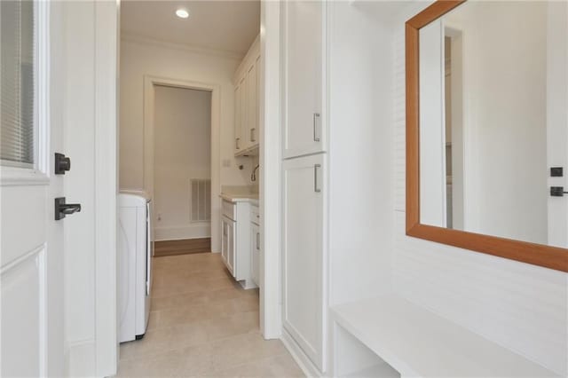 hallway with light tile patterned floors