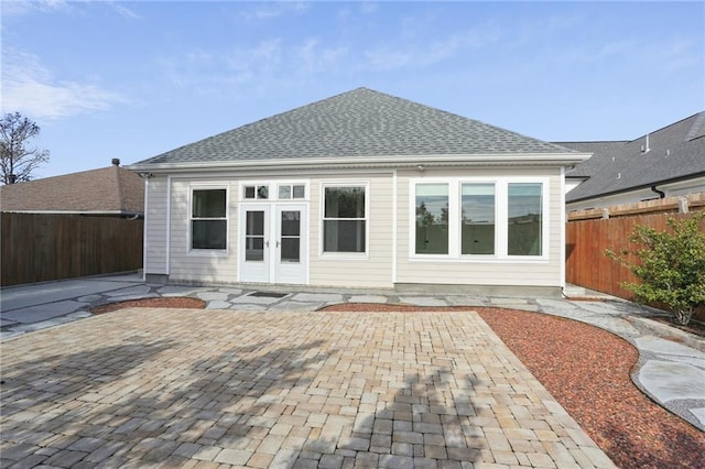 rear view of house featuring french doors and a patio