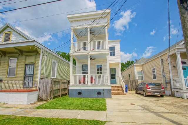 view of front facade featuring covered porch and a balcony