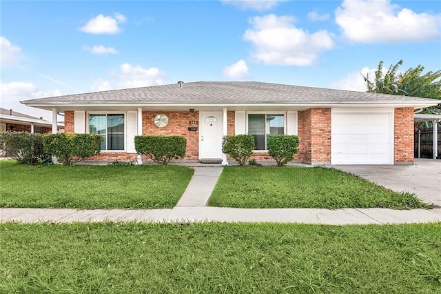 single story home featuring a garage and a front yard