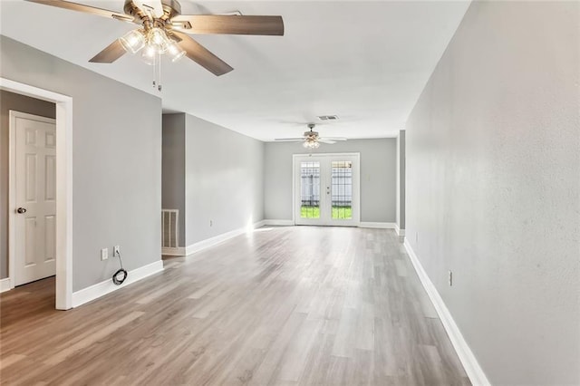 spare room with light hardwood / wood-style flooring and ceiling fan