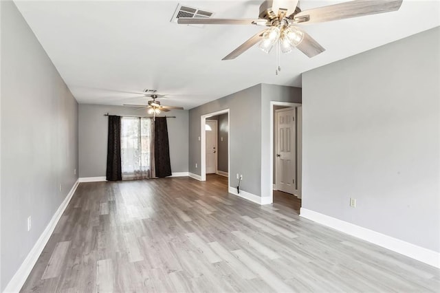 spare room with light hardwood / wood-style flooring and ceiling fan