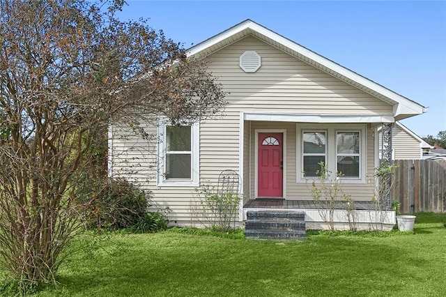 bungalow-style house with a front lawn