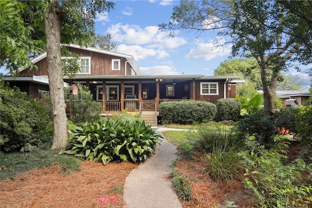 rear view of property with a porch