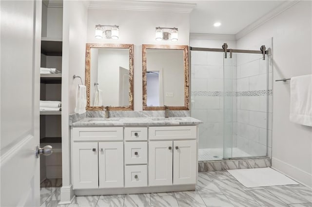 bathroom with marble finish floor, a sink, crown molding, and a shower stall