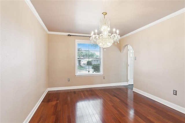 unfurnished room featuring ornamental molding, dark hardwood / wood-style flooring, and a notable chandelier