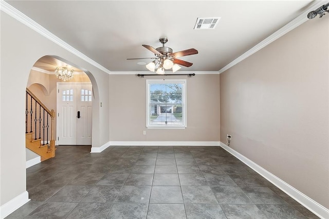 foyer entrance featuring ornamental molding and ceiling fan with notable chandelier