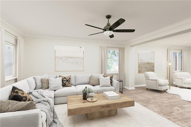 living room with light wood-type flooring, ceiling fan, and crown molding