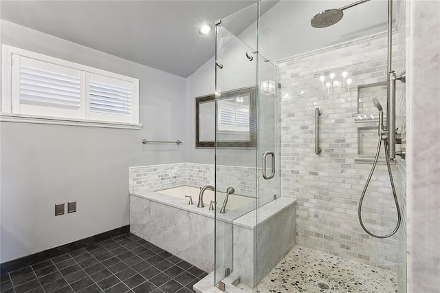 bathroom featuring independent shower and bath, lofted ceiling, and tile patterned floors