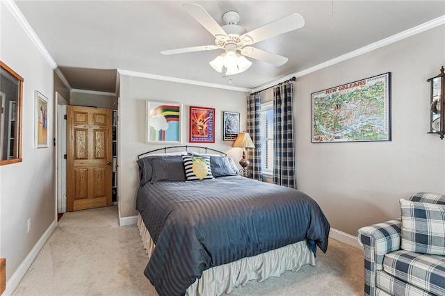 bedroom featuring ornamental molding, light colored carpet, and ceiling fan