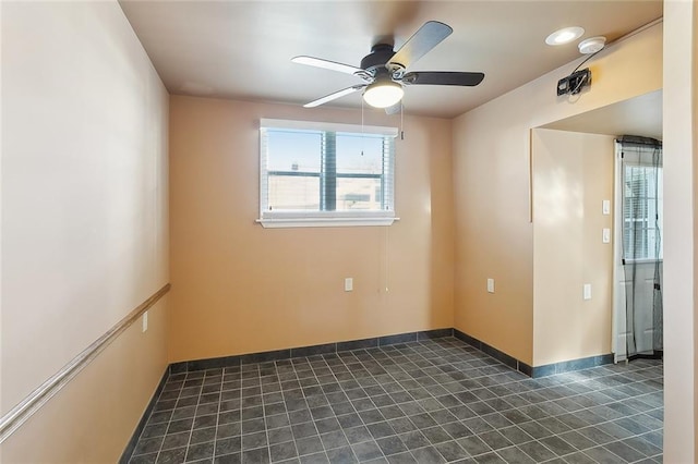 spare room with ceiling fan