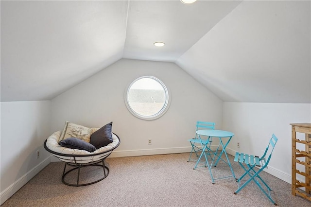 sitting room with carpet and lofted ceiling