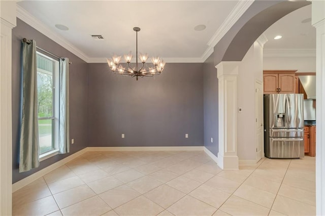 tiled empty room with ornate columns, a notable chandelier, and crown molding