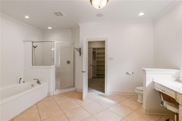 bathroom featuring tile patterned floors, crown molding, toilet, and shower with separate bathtub