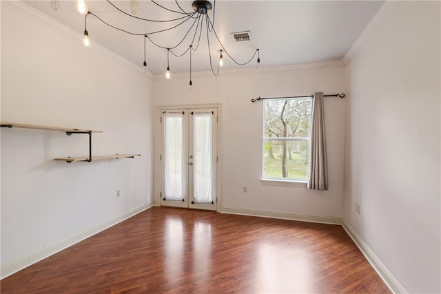 unfurnished room featuring crown molding, french doors, and hardwood / wood-style floors