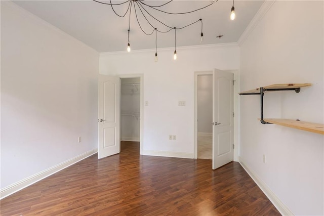 spare room with dark hardwood / wood-style floors and crown molding