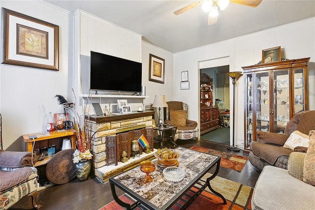 living room featuring ceiling fan, dark hardwood / wood-style flooring, and ornamental molding