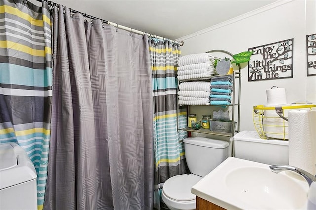 bathroom with a shower with shower curtain, ornamental molding, vanity, washer / dryer, and toilet