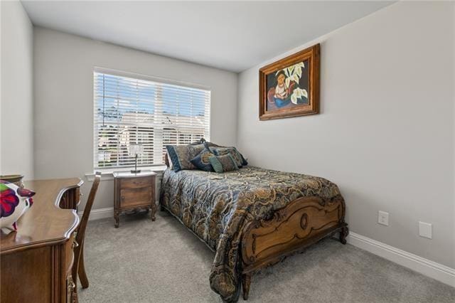 bedroom with light colored carpet